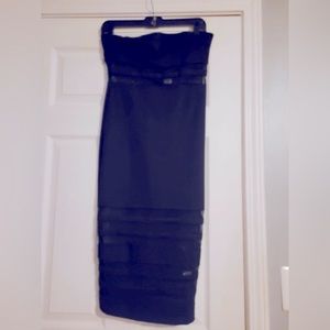 Black tube dress with detailed hem. Great for a Christmas dinner. Never worn.